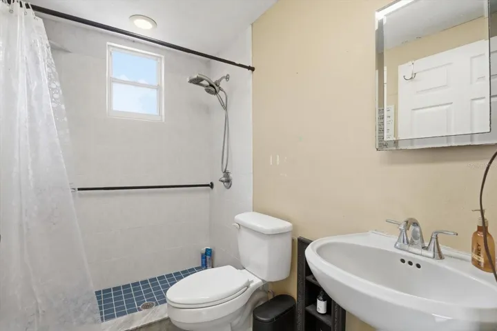 3rd full bathroom located downstairs in the garage.