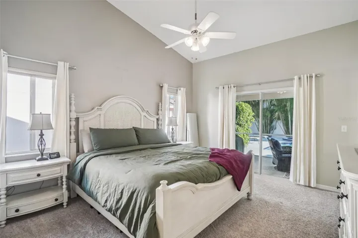 Primary bedroom with access to pool patio