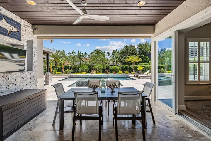 Outdoor dining with pool view
