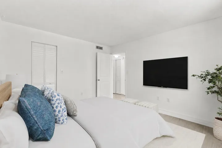 Reality Staged bedroom with walk-in closet
