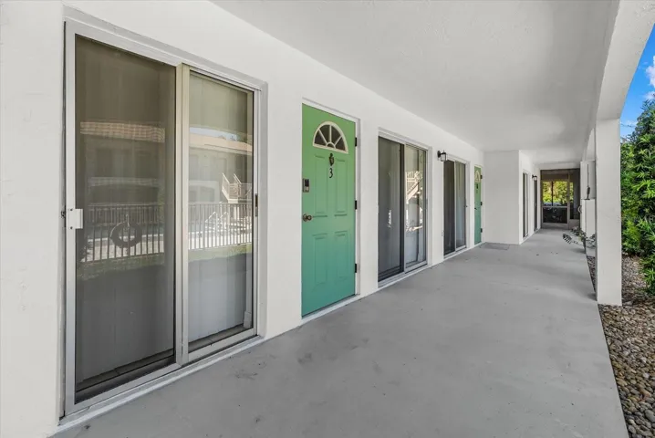 Front door is flanked with double set of sliders