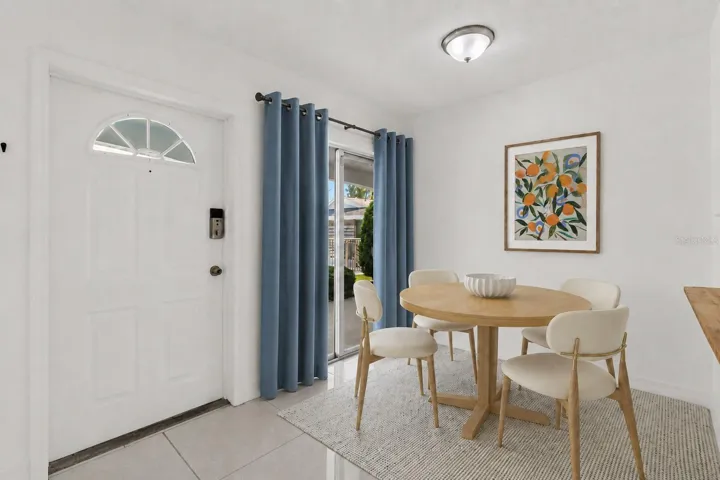 Reality Staged dinette, front door overlooks pool