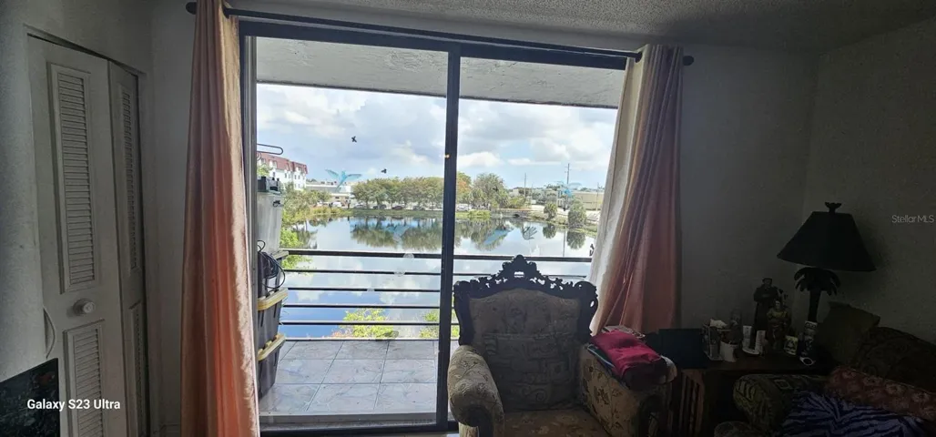 Livingroom 1 Balcony View AS IS