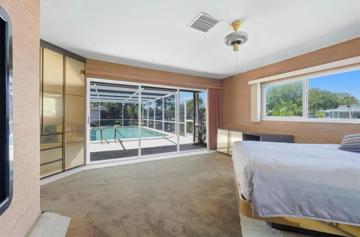 Primary Suite w/ Glass Doors to Pool & Lanai