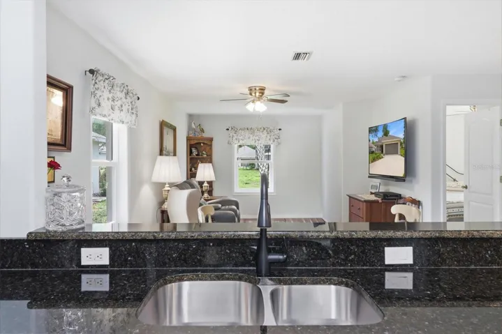 Double Basin Sink Overlooks a Dining Area/Living Room Combo