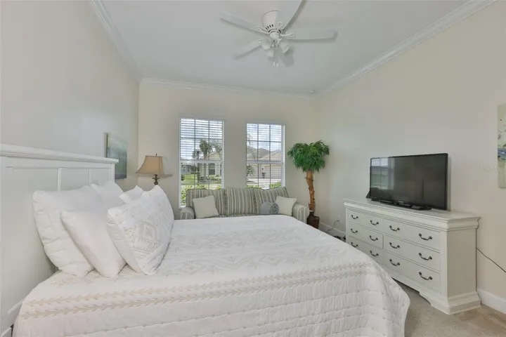 Notice the neutral paint tones, crown molding and comfortable environment.