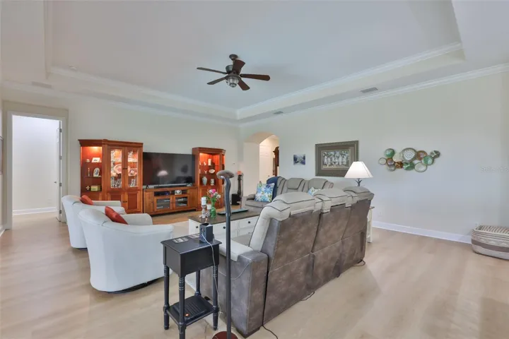 Arched doorways, large rooms and high ceilings make this an elegant and relaxing room for family and friends.