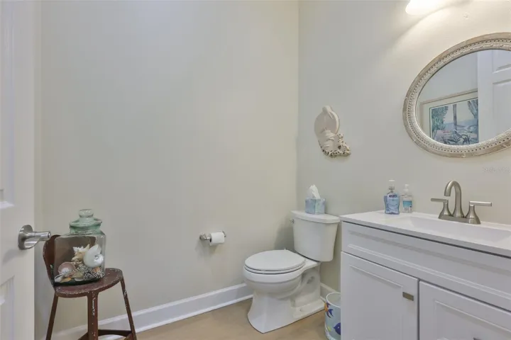 The 'powder room' is just off of the foyer for easy access for guests and privacy for anyone occupying the bedrooms.  Note the high toilets!