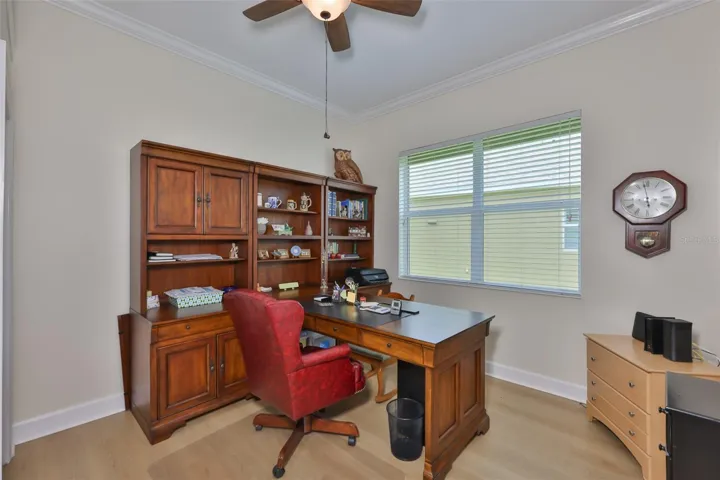 The room is bright with oversized double windows.  Notice the modern flooring is continued throughout the home.