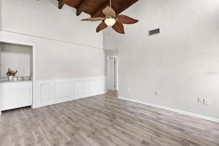 Great Room features custom storage niche..