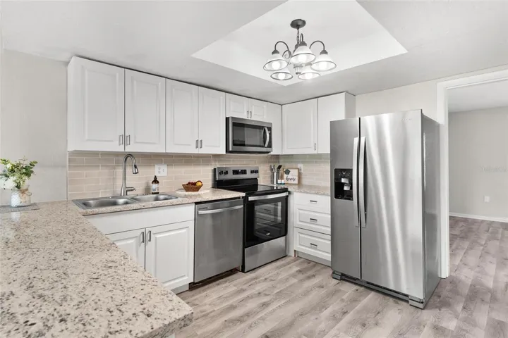 Newer stainless steel appliances in remodeled kitchen.
