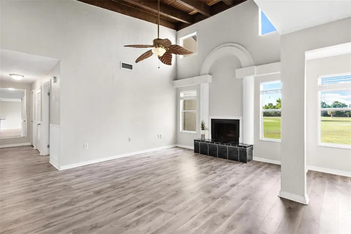 Love the vaulted wood beam ceiling and cozy fireplace!