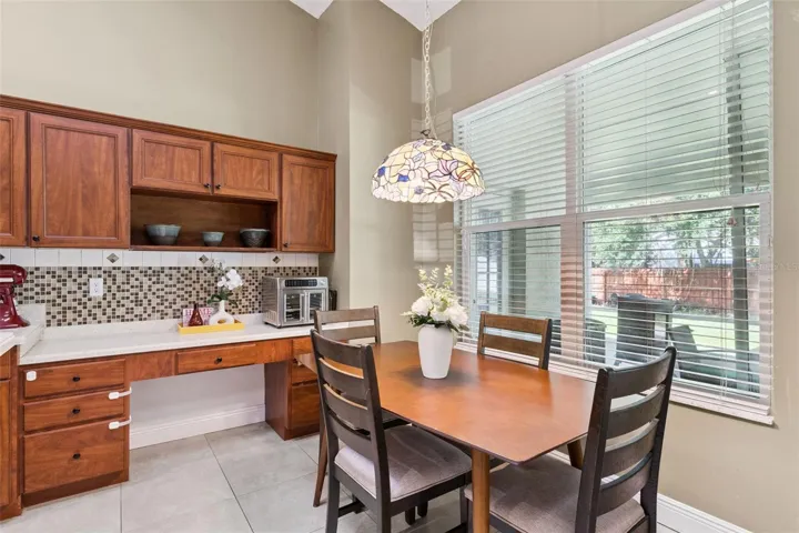 Enjoy your morning coffee with a view! The large picture window brings character and brightness to this casual everyday dining area.