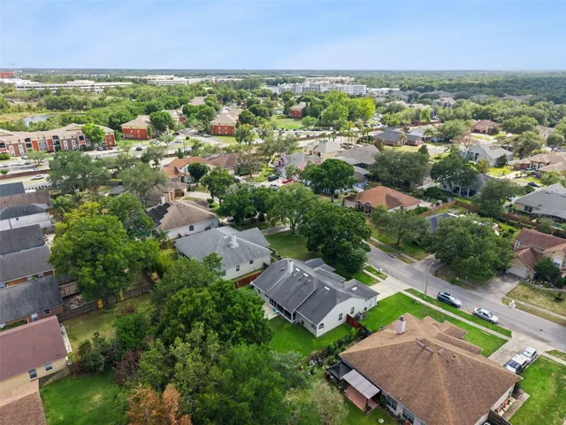 A true bird's-eye view of paradise. This aerial perspective highlights the impressive lot size and prime placement within the highly sought-after Kingston Oaks community.