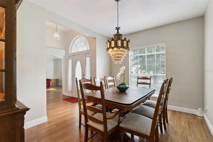 This bright foyer transitions seamlessly into the formal dining room and flexible living spaces, establishing a perfect flow from the start.