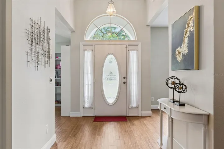Step inside 3883 Kingston Oaks Cv. This inviting entryway opens right into the main living areas, highlighting the vaulted ceilings the moment you walk through the front door.