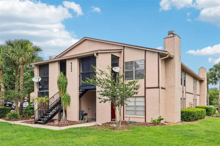 NEW ROOF (2024) ~ UPDATED A/C (2023), NEWER WATER HEATER (2023), and EXTERIOR PAINT (2021), make this second-floor condo an easy choice for anyone seeking LOW MAINTENANCE LIVING in a convenient Orlando location!