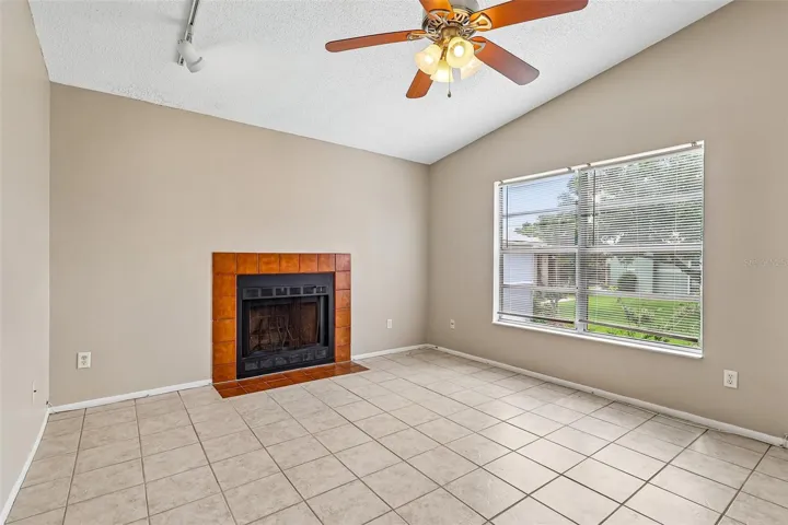 Lagre windows, tile floors thoughout and a cozy fireplace in the living area are just the start of things you will love about this home.