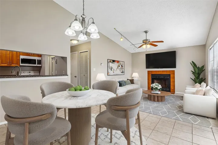 The vaulted ceilings add to the light and bright feel of the open living and dining areas. Virtually Staged.