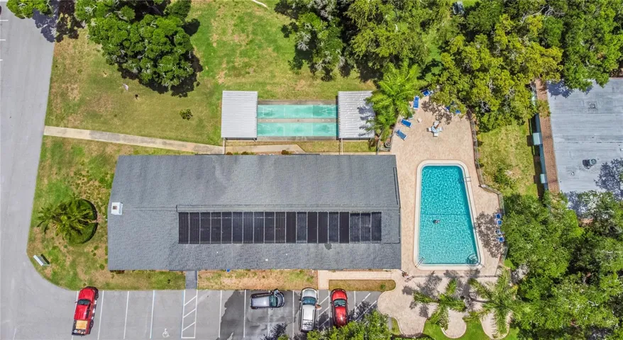 Aerial view of the clubhouse, community pool and shuffleboard courts.