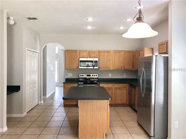 Large open kitchen * tile flooring