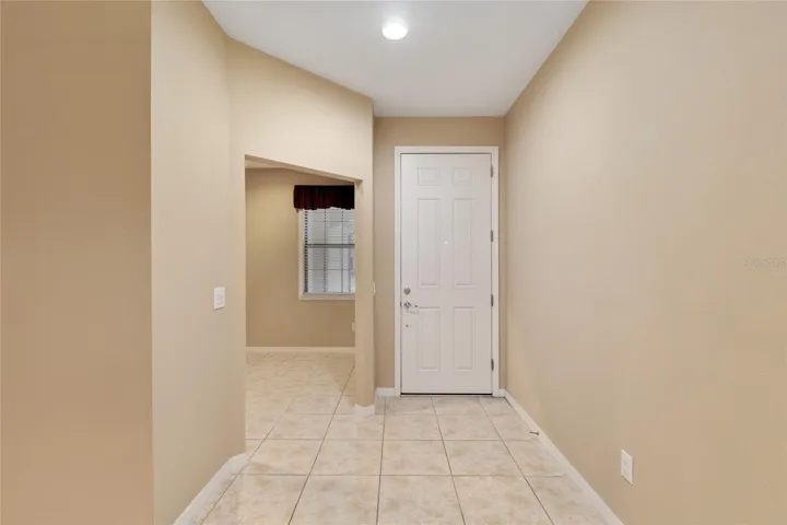 Towards front door with office to your left