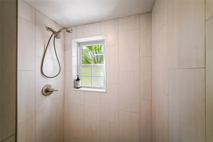 Stand up shower w/ new tile work in primary bathroom