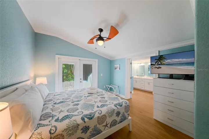 Primary suite w/ french doors to private patio off of the primary suite