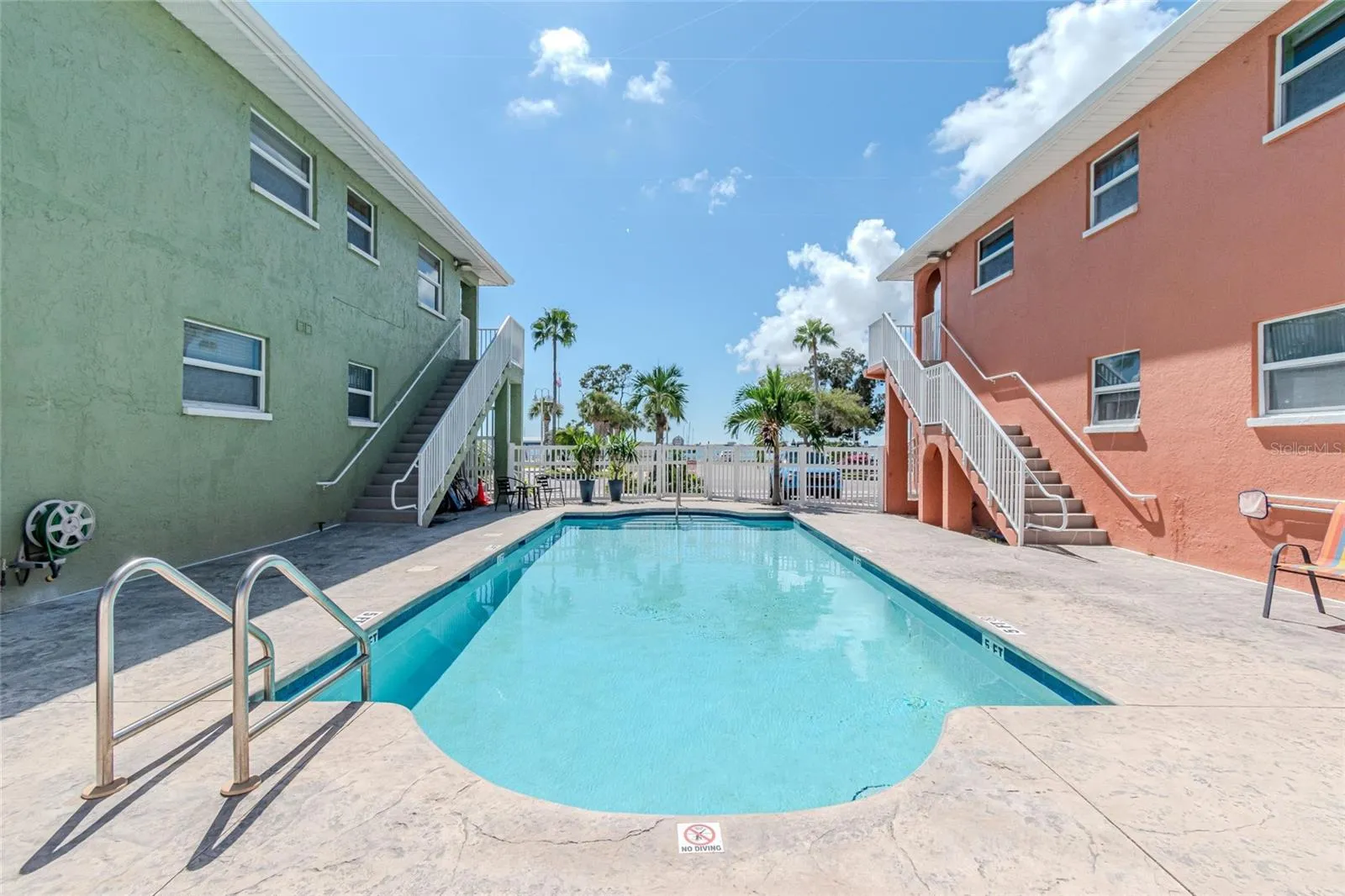 VIEW OF POOL BETWEEN THE BLDGS.