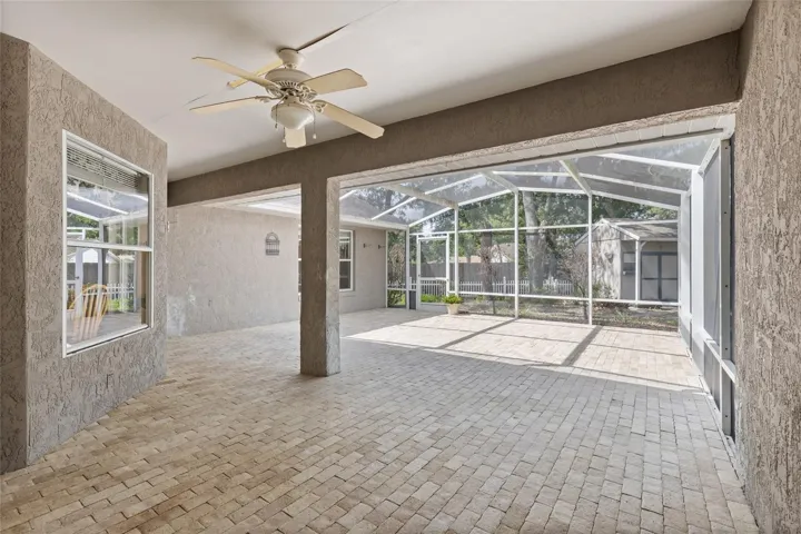 Huge screened patio with brick paver floor