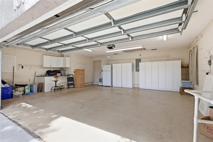 Extra wide garage with work area. Bonus that there is a separate HVAC system that cools the garage!