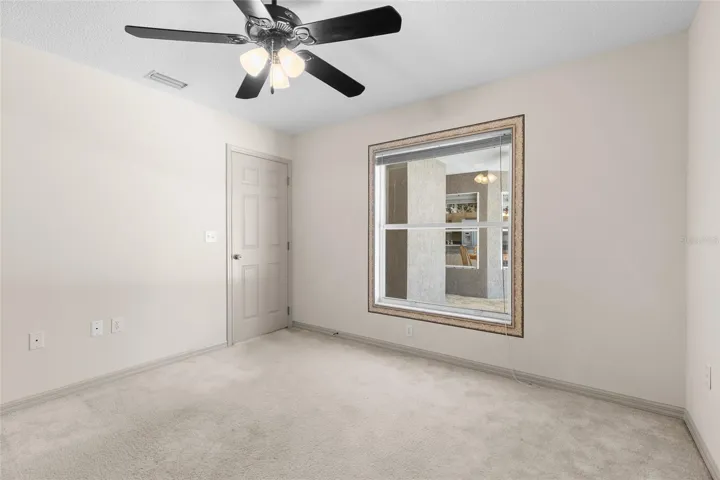 Bedroom 2 has window facing the screened patio