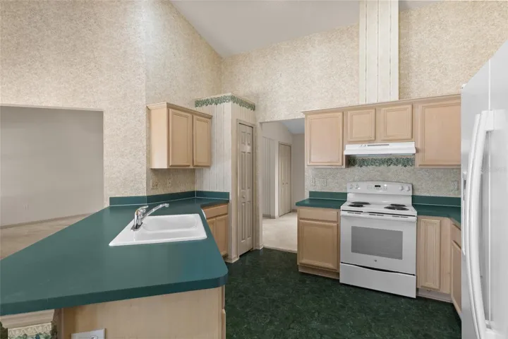 Kitchen flows into dining room and living room