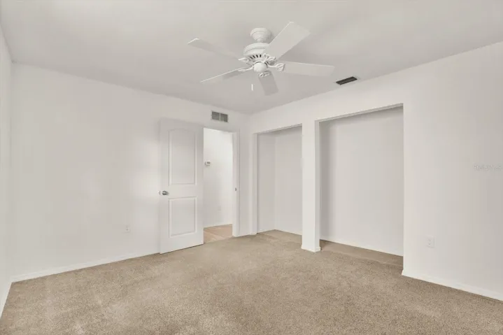 Additional view of second bedroom showcasing the spacious closet perfect for storage.
