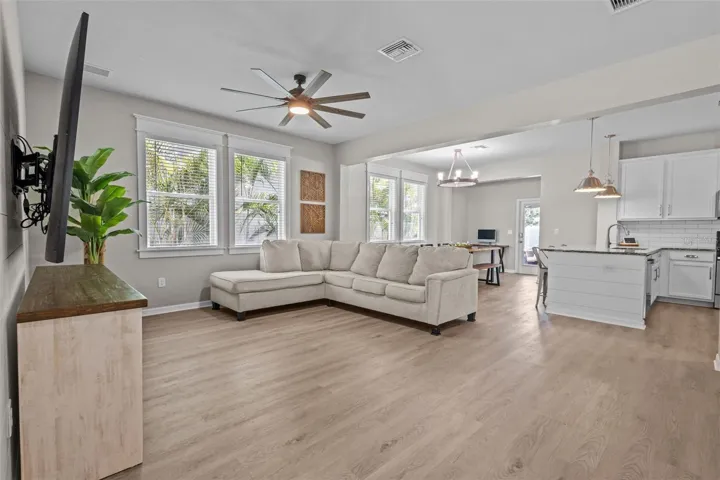 Luxury vinyl plank flooring and cohesive finishes give the main living area a polished feel