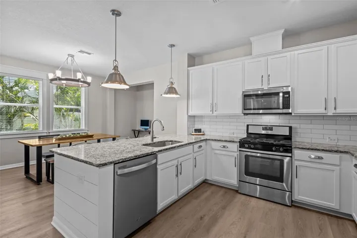 Open kitchen connects directly to the dining and living areas