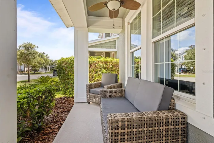 Broad covered front porch offers a welcoming place to relax and enjoy the neighborhood