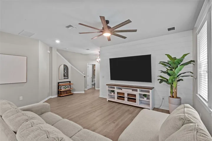 Custom wood window trim and a shiplap feature wall add warmth and architectural character