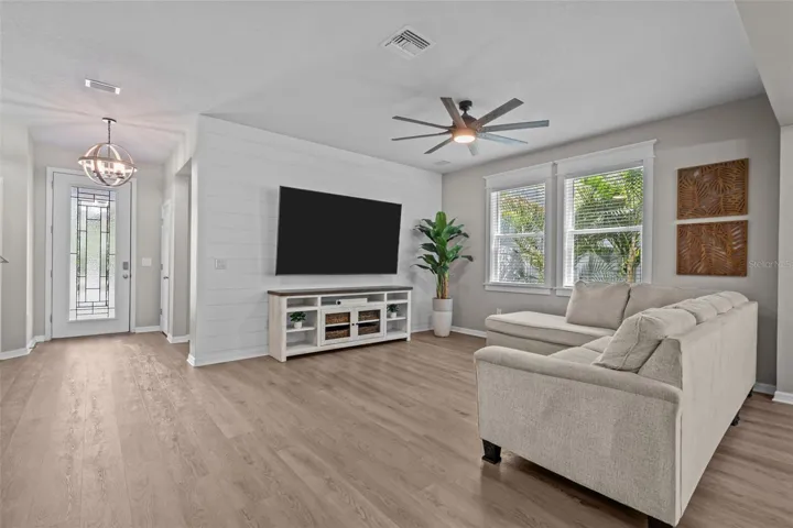 Custom wood window trim and a shiplap feature wall add warmth and architectural character