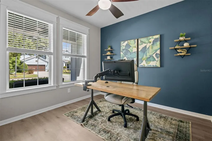 Front flex room provides versatile space for a home office, den, studio, or sitting room