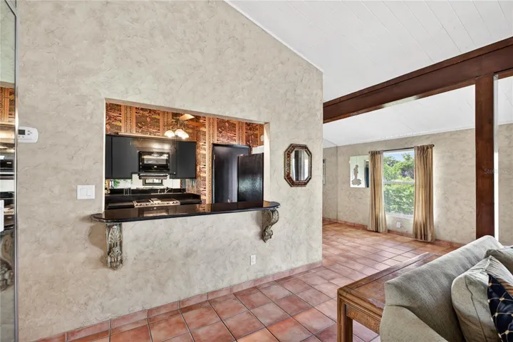 Breakfast bar/pass through to the living room.