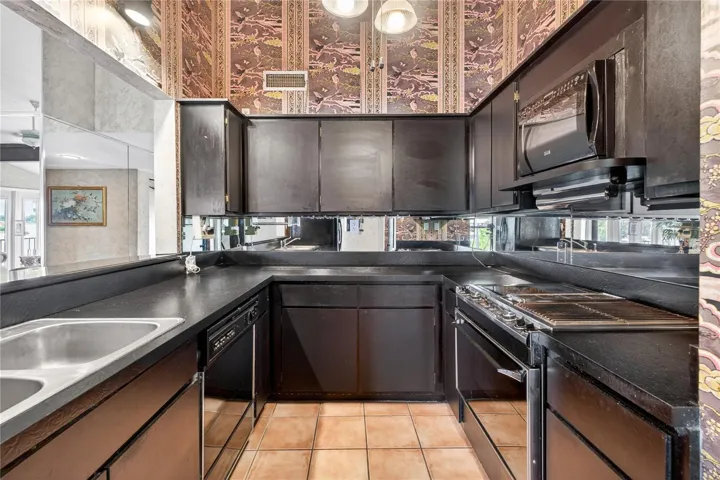 Kitchen with a breakfast bar and an abundance of counter space.