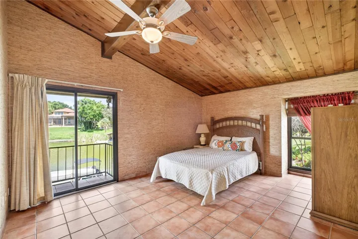 Primary ensuite with balcony overlooking the lake.