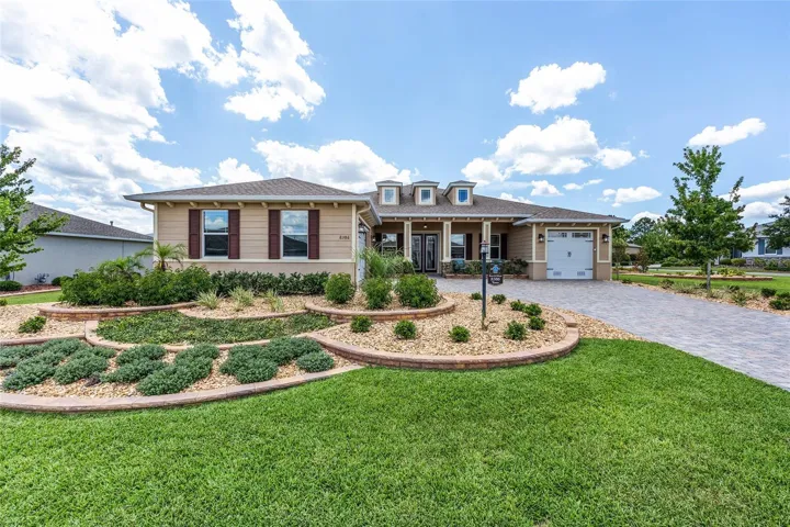 Front Exterior Featuring Extensive Professional Landscaping