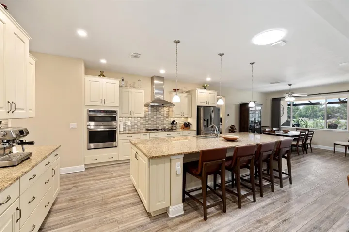 Gourmet kitchen featuring a generous island and granite counter surfaces