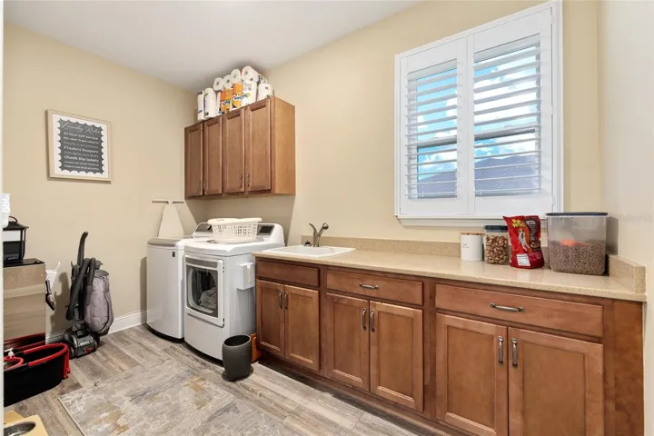 Laundry room offering extra built-in cabinets for enhanced functionality.