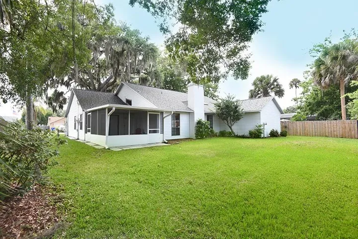 view of the screened porch and back yard