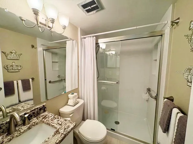 Guest bathroom remodeled with solid wood vanity/granite