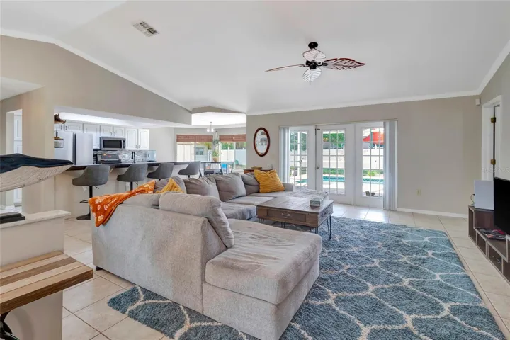 Living Room with Ceiling fan and tile