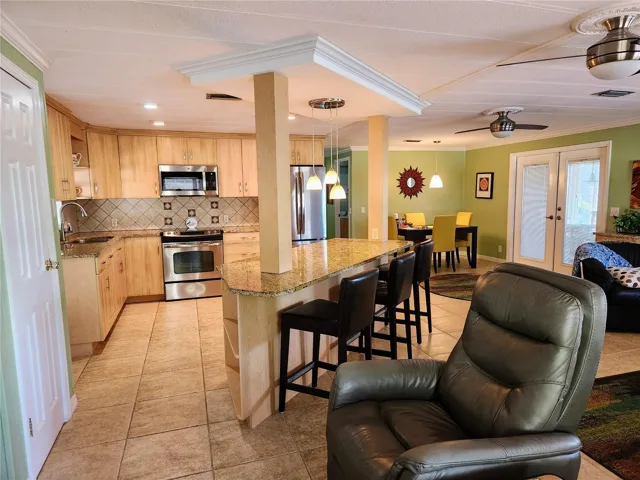Custom kitchen with island and open floor plan